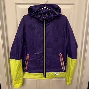 Nike Shield Checkerboard Running Jacket. Vinyls along back have slight wear.